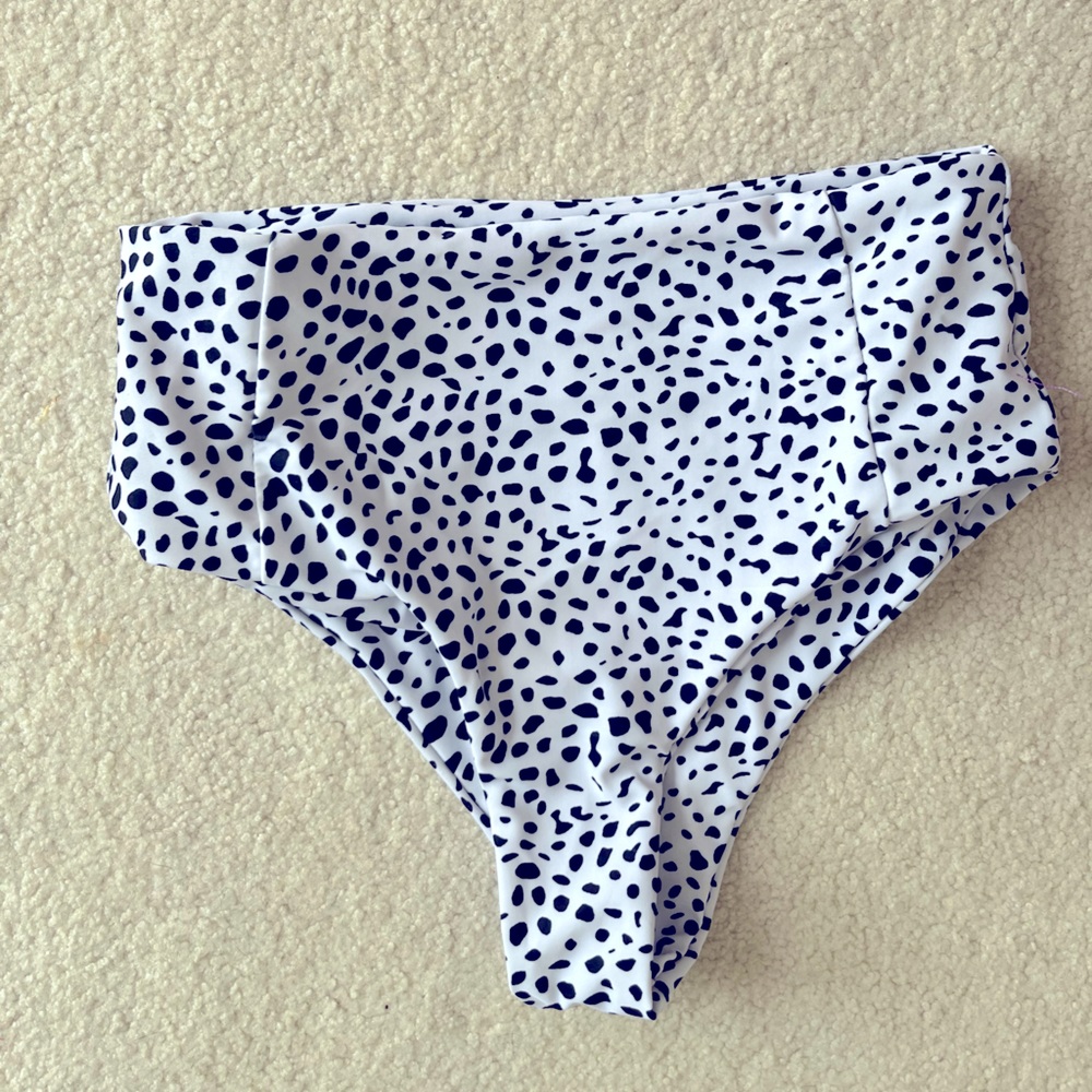 A dalmatian print bikini bottom high waisted and cheeky.